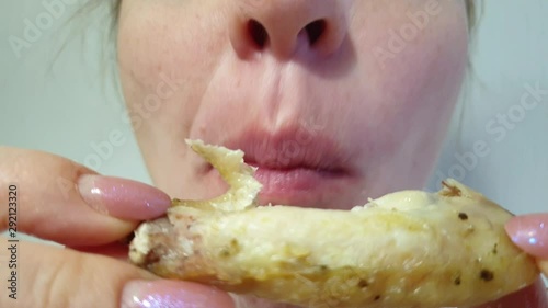 woman eats fried chicken, fatty and high-calorie food