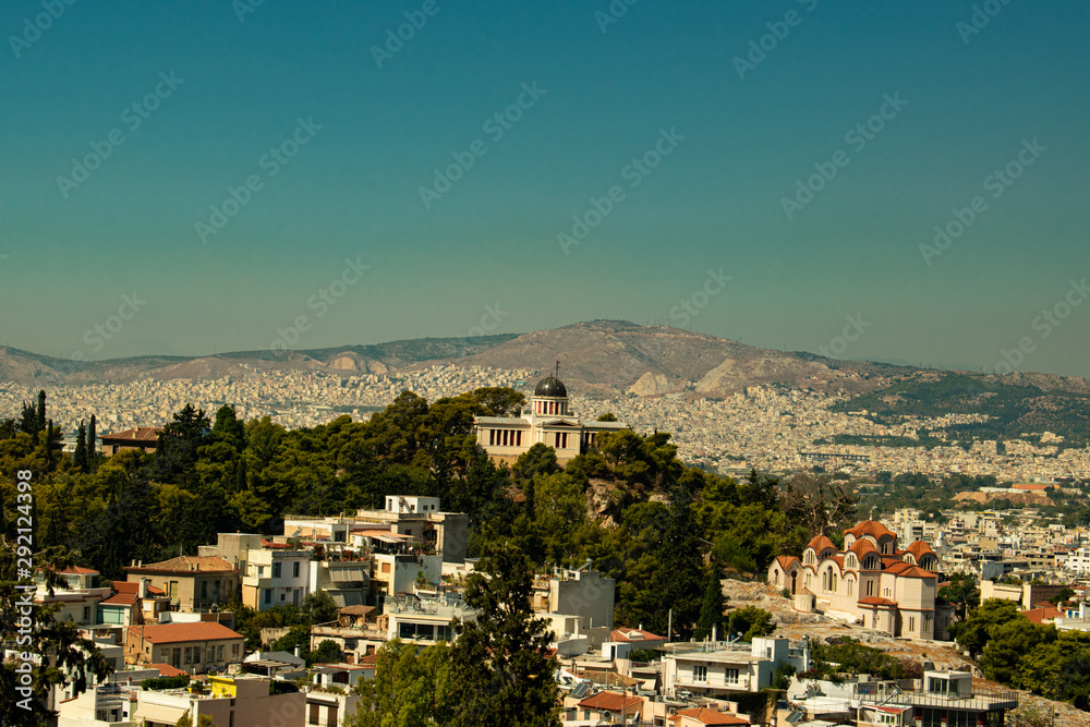 Beautiful landscape view of Athens, Greece on a sunny day with no clouds, with a big church in the center of the city