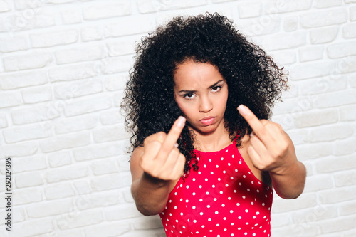 Angry Woman Showing Middle Finger For Fight Argument photo