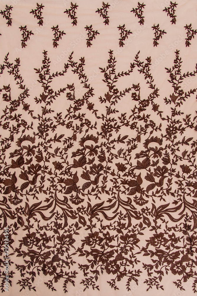 Texture lace fabric. lace on white background studio. thin fabric made of yarn or thread. a background image of ivory-colored lace cloth. Brown lace on beige background.