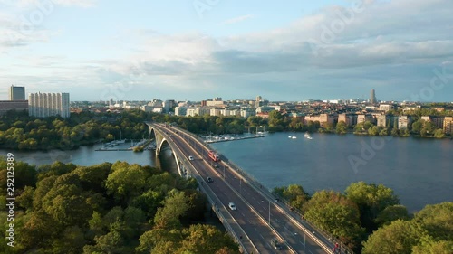 Drone flies across bridge and traffic, aerial view Vasterbron Stockholm Sweden photo