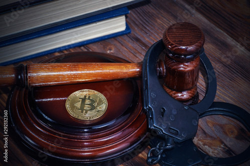 bitcoin, judge's hammer, handcuffs. Concept bitcoin ban, violation of the law.