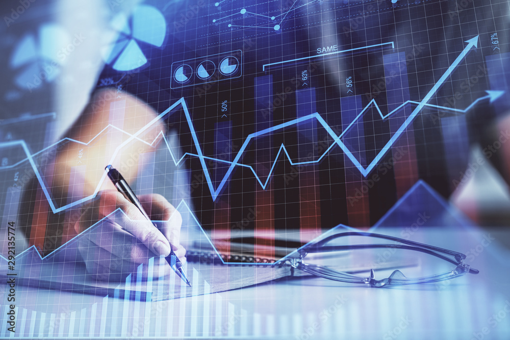 Multi exposure of woman's hands making notes with forex graph hologram. Concept of technical analysis. Multi exposure of woman's hands making notes with forex graph hologram. Concept of technical analysis.