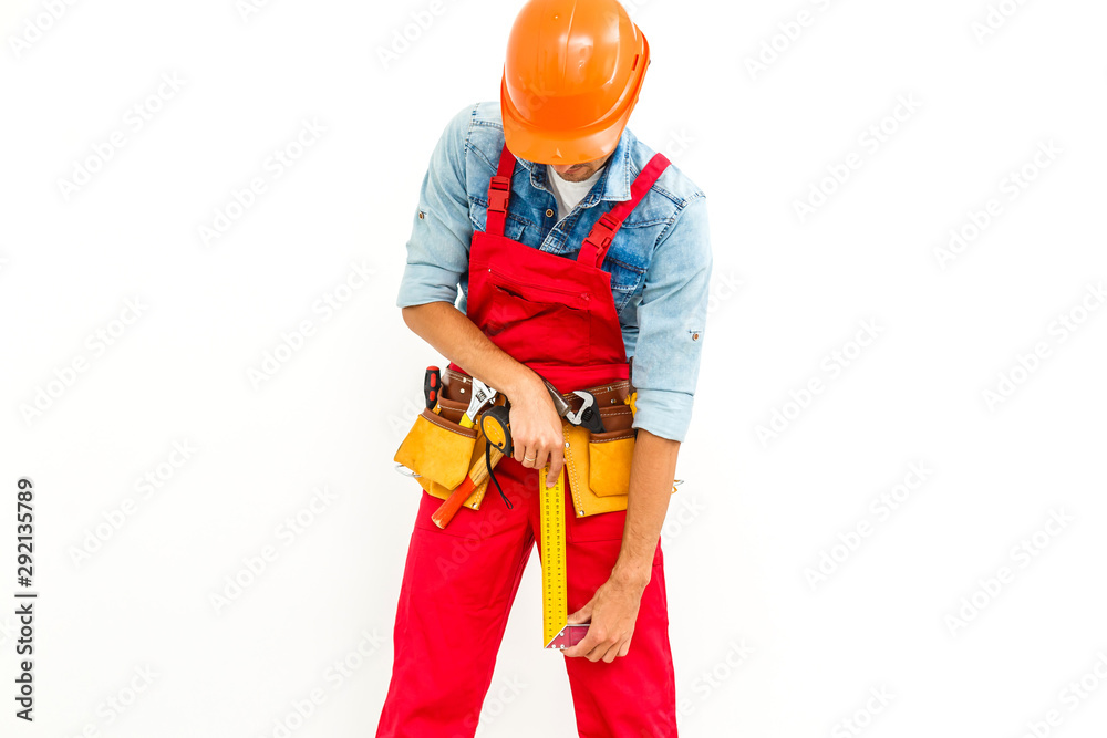 Worker in hard hat measure with ruler. Isolated on a white background. Worker in hard hat measure with ruler. Isolated on a white background.