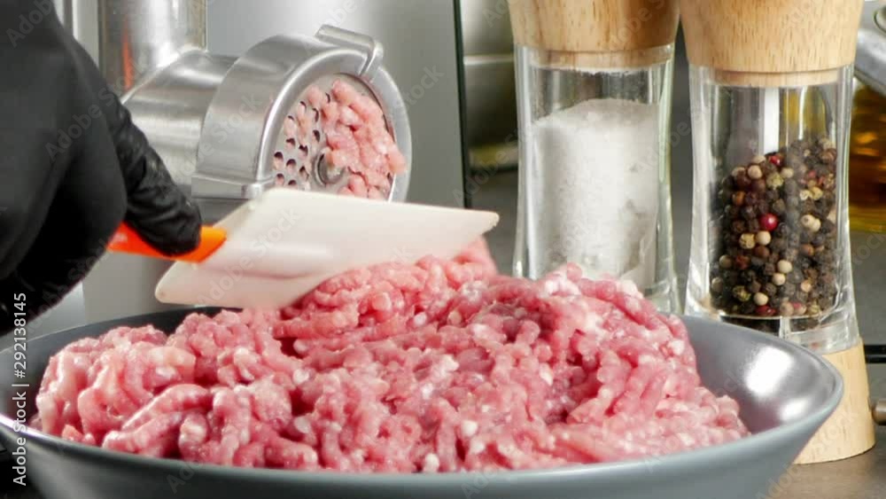 Grinding meat in a food processor. Removing excess meat. Grinding meat in a food processor. Removing excess meat.