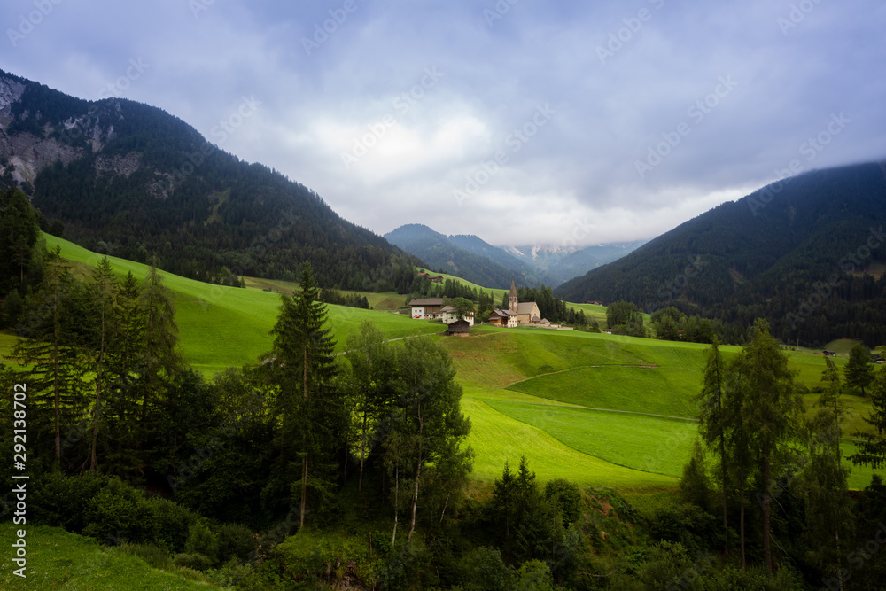 Obraz premium View of the Italian village of Santa Maddalena. Perfect landscape with mountains