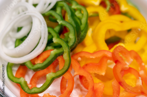 Fresh Onion and Green, Red, Yellow pepper sliced.