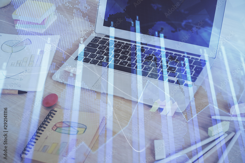 Fototapeta premium Forex market graph hologram and personal computer on background. Double exposure. Concept of investment.