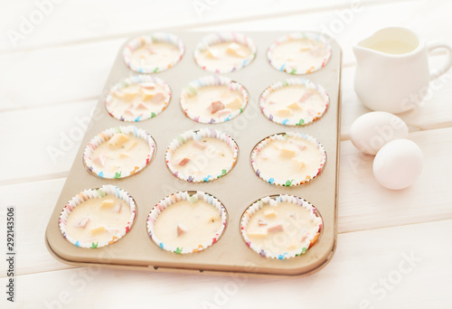 ham and cheese muffins on white wooden background