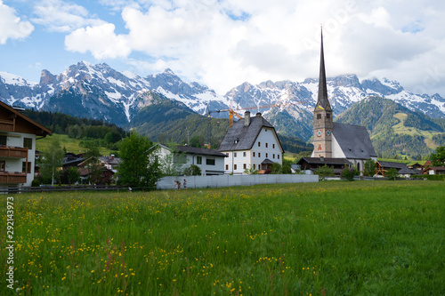 Maria Alm parish church with background of mountains.