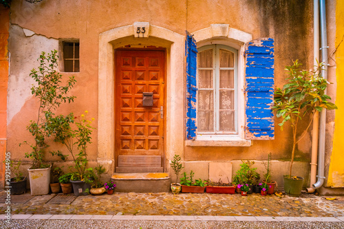 Fototapeta Naklejka Na Ścianę i Meble -  View of a narrow street in the historical center of Arles