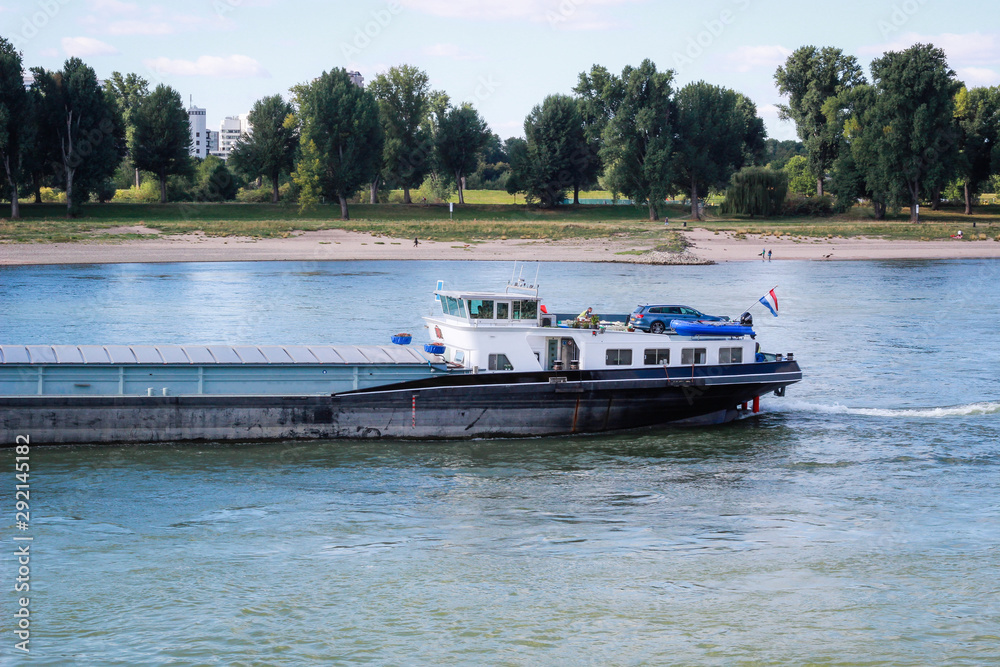 Obraz premium Cargo ship. International logistics. Delivery of goods. Dusseldorf. Germany