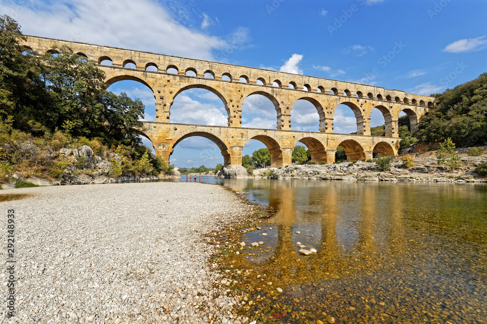 REMOULINS, FRANCE, SEPTEMBER 20, 2019 : The Pont du Gard, the highest Roman aqueduct bridge, and one of the most preserved, was built in the 1st century, added to list of World Heritage Sites in 1985.