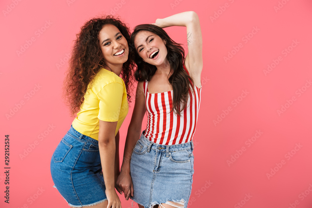 Image of alluring multinational girls smiling together at camera Image of alluring multinational girls smiling together at camera