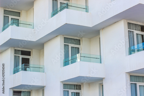 white building facade exterior background of balcony terraces 