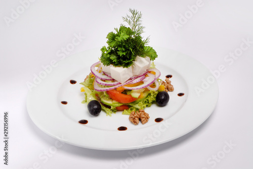 Vegetarian dish: Salad with Tofu cheese, with onions, sweet peppers, olive, lettuce and sprouted seeds