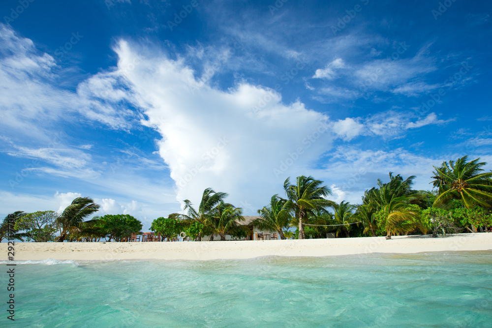 Beautiful tropical Maldives island with beach , sea , and blue sky for nature holiday vacation background concept Beautiful tropical Maldives island with beach , sea , and blue sky for nature holiday vacation background concept