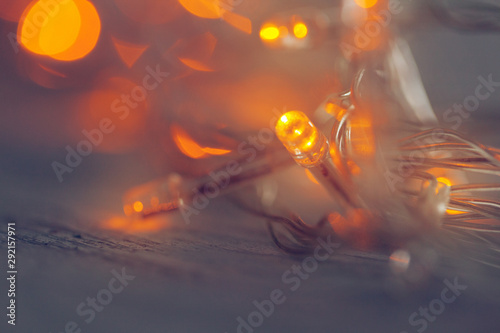 Illuminated garland close up on dark background