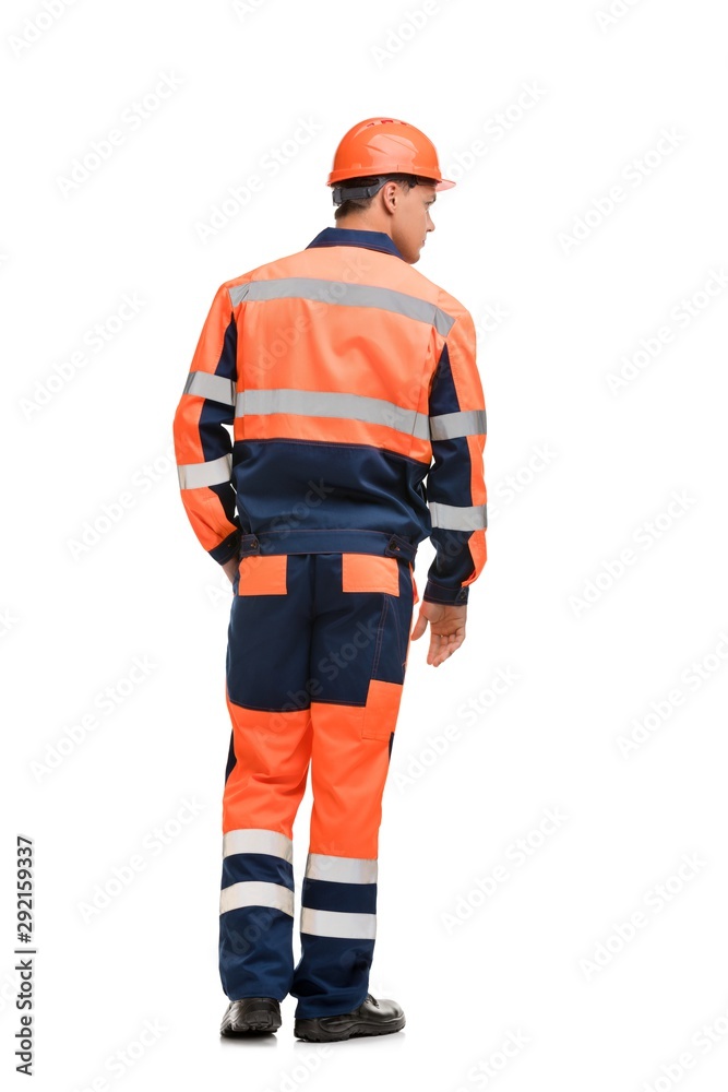 Man in working clothes and helmet isolated view Man in working clothes and helmet isolated view