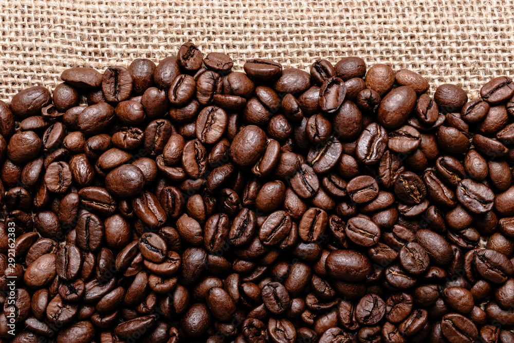 Coffee beans on burlap background Coffee beans on burlap background