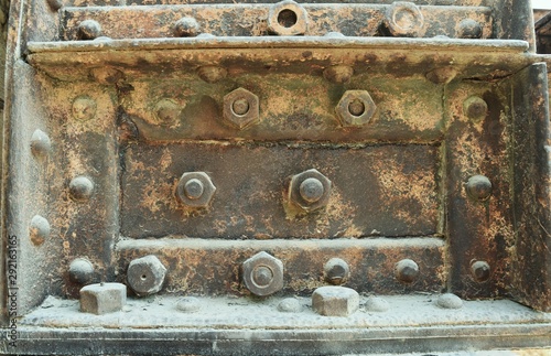 detail of a rusted and dusted steel old structure with rivets and bolts 