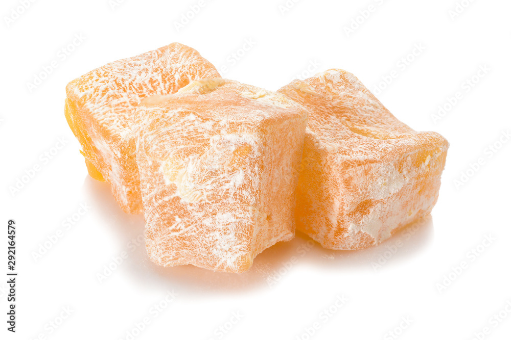 Turkish delight. Pistachio rahat locum with nuts, three pieces of sweet oriental delights in powered sugar. Close-up view. Turkish delight. Pistachio rahat locum with nuts, three pieces of sweet oriental delights in powered sugar. Close-up view.