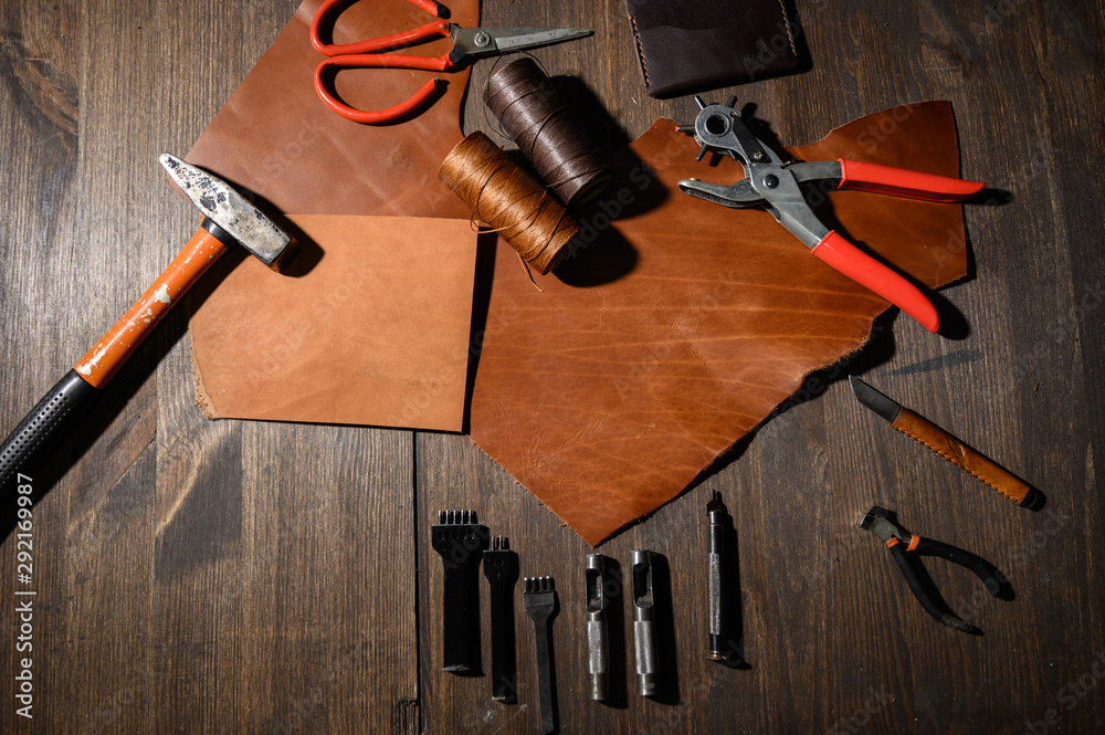 Premium Photo  Leather craft or leather working leather working tools and  cut out pieces of leather on work desk