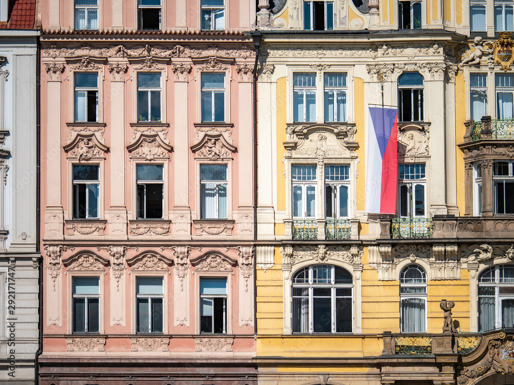 Classic Bohemian town house architecture adored with the national flag of the Czech Republic in the historic Prague city centre.