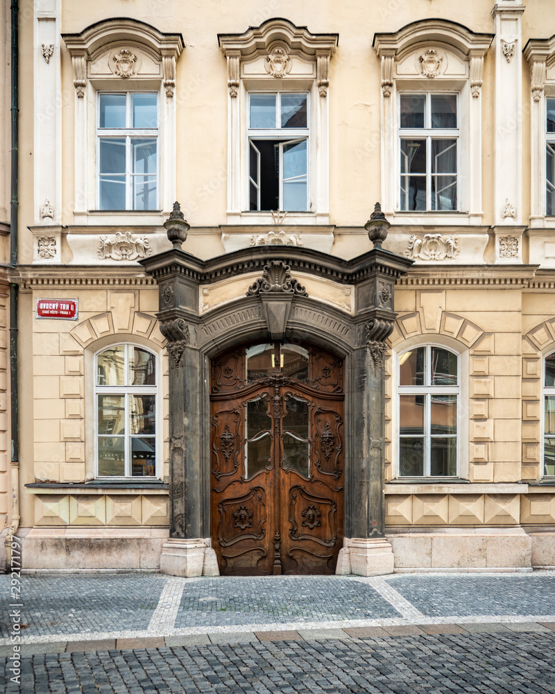 Prague Town House. An ornate wooden door and elaborate entrance to a typical townhouse in the Old Town district of central Prague, Czech Republic.