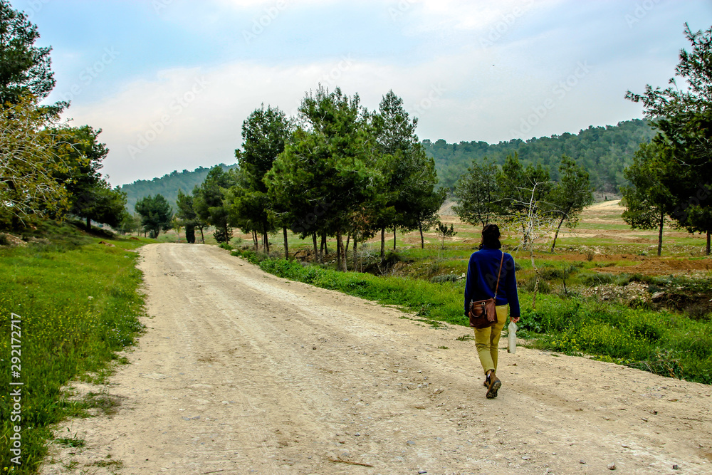 woman walking in the forest