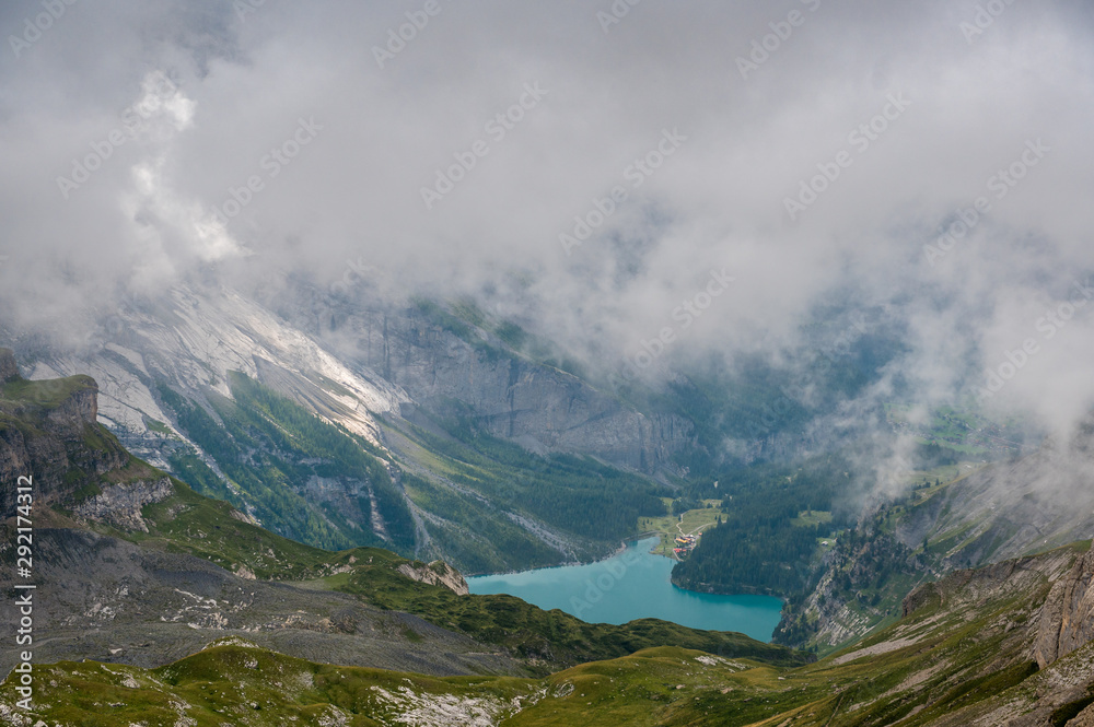 landscape of Kiental in misty clouds while hiking