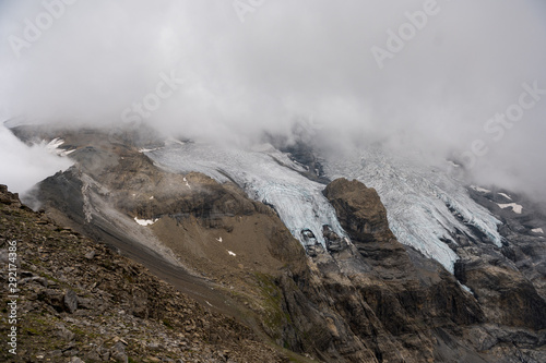 Blüemlisalpglaciers in clouds photo