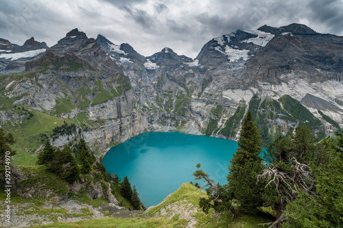 view of turquoise Lake Oeschinensee from high above in the Swiss Alps