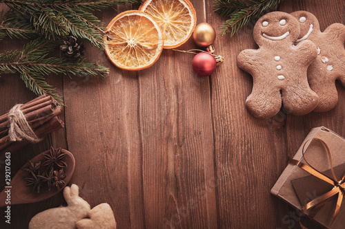 Christmas decorations with fir tree and light garland on wooden background wi...