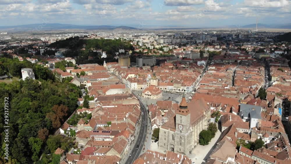 Reverse aerial view of the Black Church and Brasov main square on a sunny day Reverse aerial view of the Black Church and Brasov main square on a sunny day