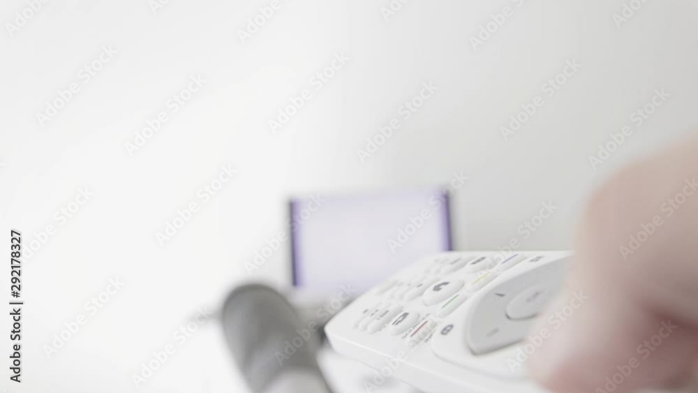 Man looking at TV with legs on the table in living room. Man looking at TV with legs on the table in living room.