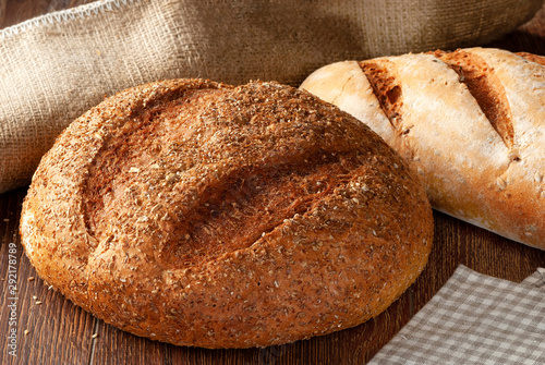 Composition of bread close-up on a wooden background.