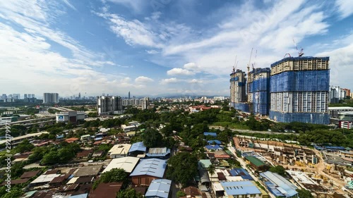 Beautiful time lapse motion during daylight, building construction, developing new high building, aerial view, blue sky scene in Kuala Lumpur.