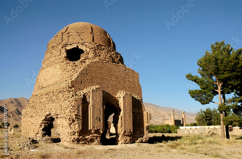 Chisht-e-Sharif, Herat Province, Afghanistan. One of two brick domes from the Ghorid period in Chisht e Sharif (or Chist e Sharif) in western Afghanistan. The ancient monument with a mosque behind. photo