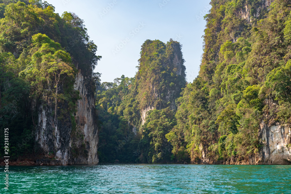 Limestone mountains with trees in the sea in Thailand