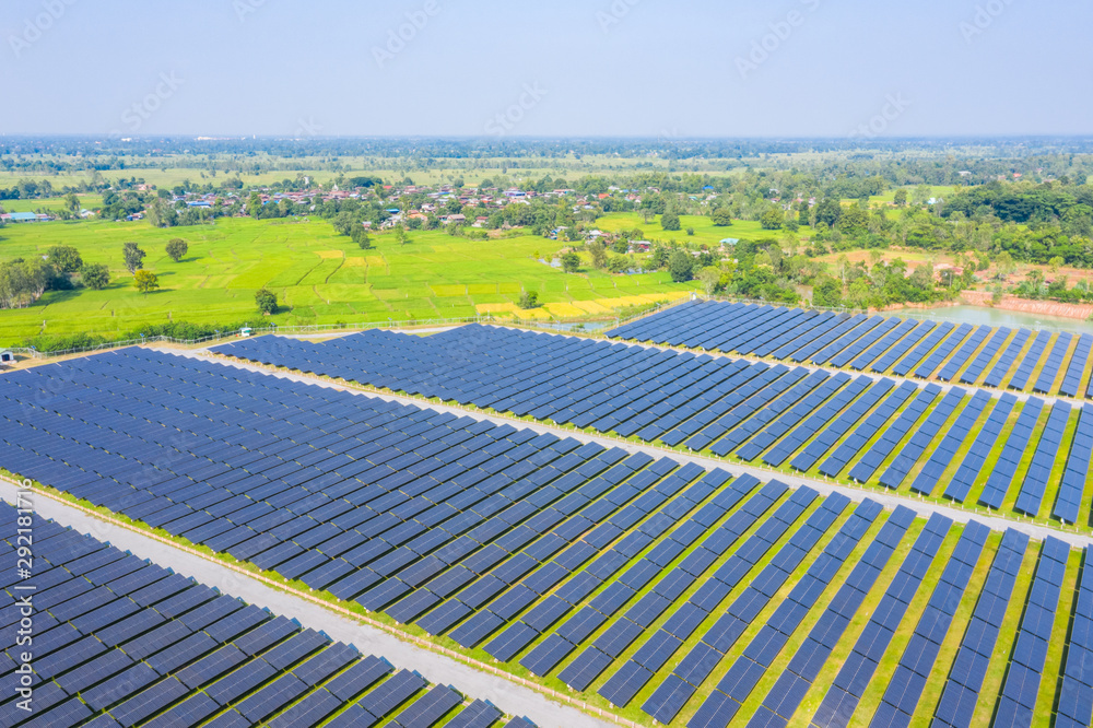 Aerial view from drone of Solar energy farm, High angle view of solar panels on an energy farm for renewable energy in Thailand.