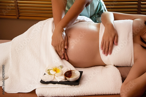 Wallpaper Mural The therapiist hands massaging belly of pregnant woman,for treat and relax program,at spa therapy Torontodigital.ca