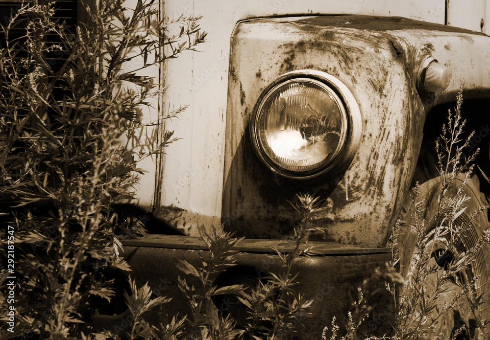 Old abandoned rusted car detail, toned horizontal image