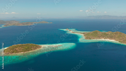 aerial drone tropical islands with blue lagoons, coral reef and sandy beach. Palawan, Philippines. Islands of the Malayan archipelago with turquoise lagoons. © Alex Traveler
