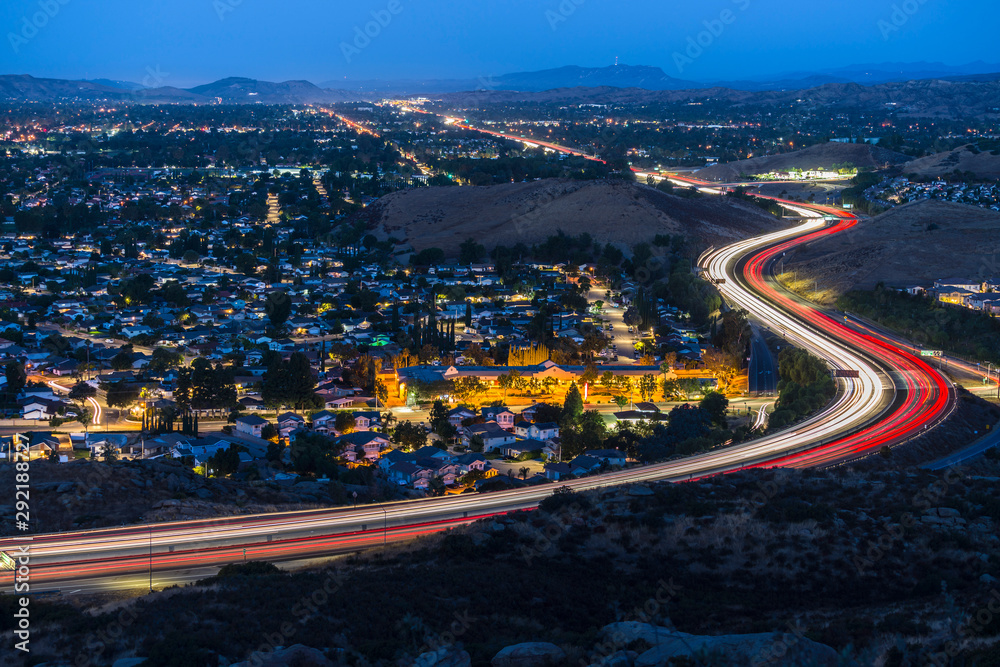 Twilight view of commuter freeway traffic in suburban Simi Valley near Los Angeles in Ventura County, California.