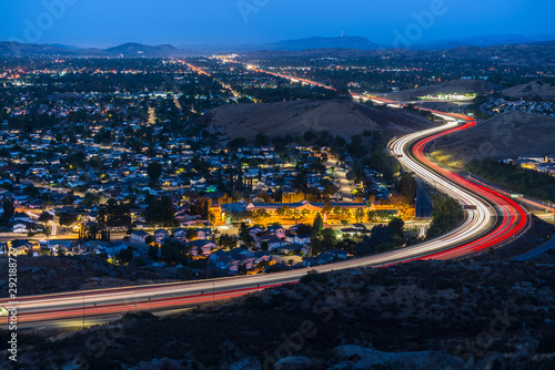 Twilight view of commuter freeway traffic in suburban Simi Valley near Los Angeles in Ventura County, California.