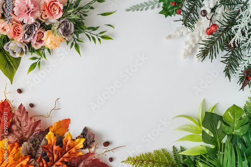 Creative season layout of colorful summer, spring, autumn and winter leaves and flowers. Nature mockup background. Seasonal concept. Flat lay
