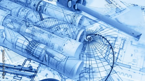 Blueprints - rolls of architectural drawings and drawing of the gold section smoothly rotate on the surface of the architectural plan of a modern house	