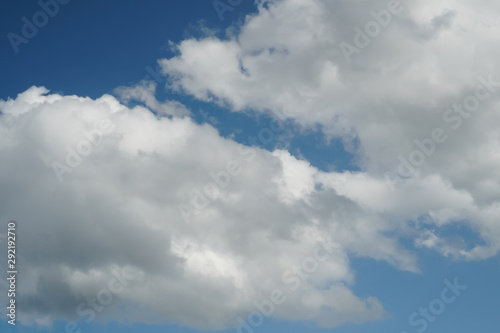 Large cumulus clouds on a bright blue sky