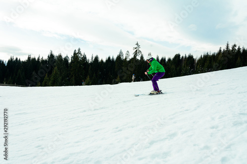 A man in a professional outfit rushes from the mountain skiing in the Ukrainian mountains